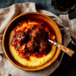 Luscious Red-Wine Braised Meatballs Over Cheesy Polenta