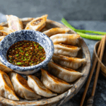 Sheet Pan Spicy Chicken Potstickers with Ginger Sauce