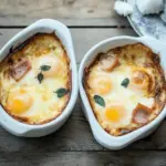 Baked eggs with ham and tomato