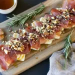 Crispy Prosciutto Wrapped Boursin Cheese with Honey and Chopped Nuts