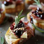 Irresistible Cranberry, Brie and Prosciutto Crostini Magic 10 Cranberry, Brie and Prosciutto Crostini with Balsamic Glaze